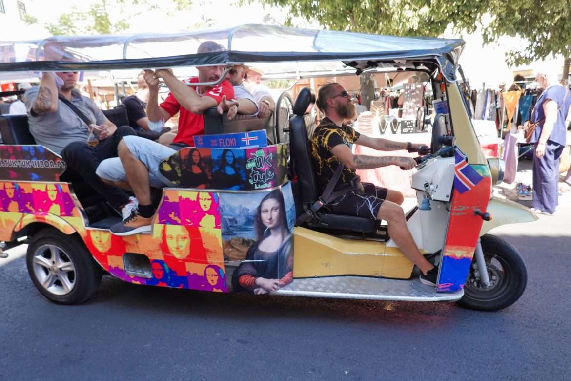 A tuk tuk in Lisbon, Portugal wrapped in images of the Mona Lisa