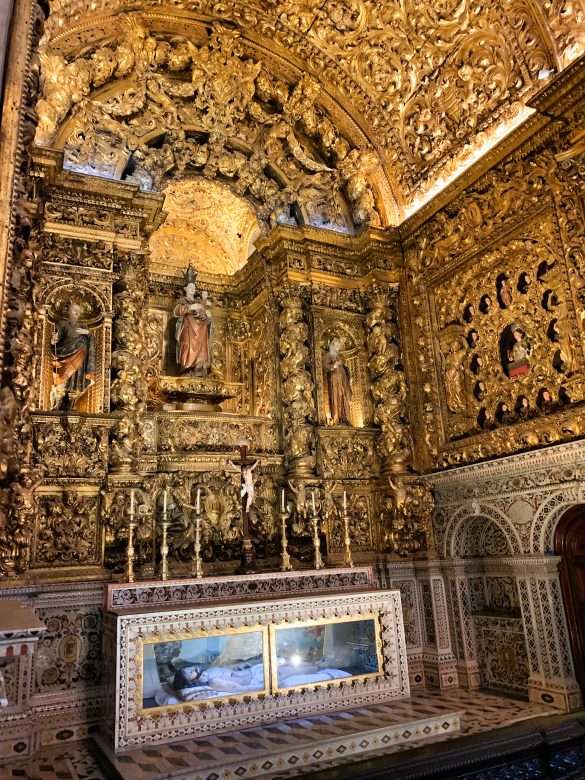 A view of one of the chapels inside Igreja de São Roque, showcasing the intricate details of the Baroque architecture.