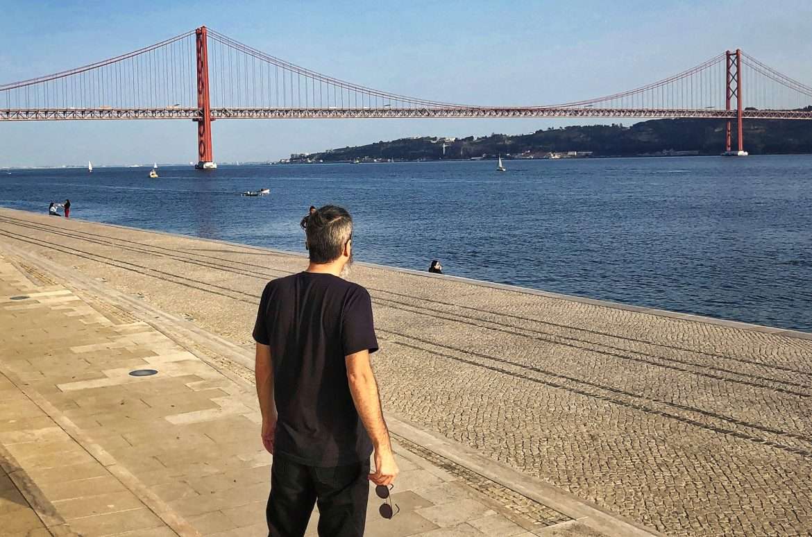 Captivating view of the April 25th Bridge and Tagus River in Lisbon, Portugal